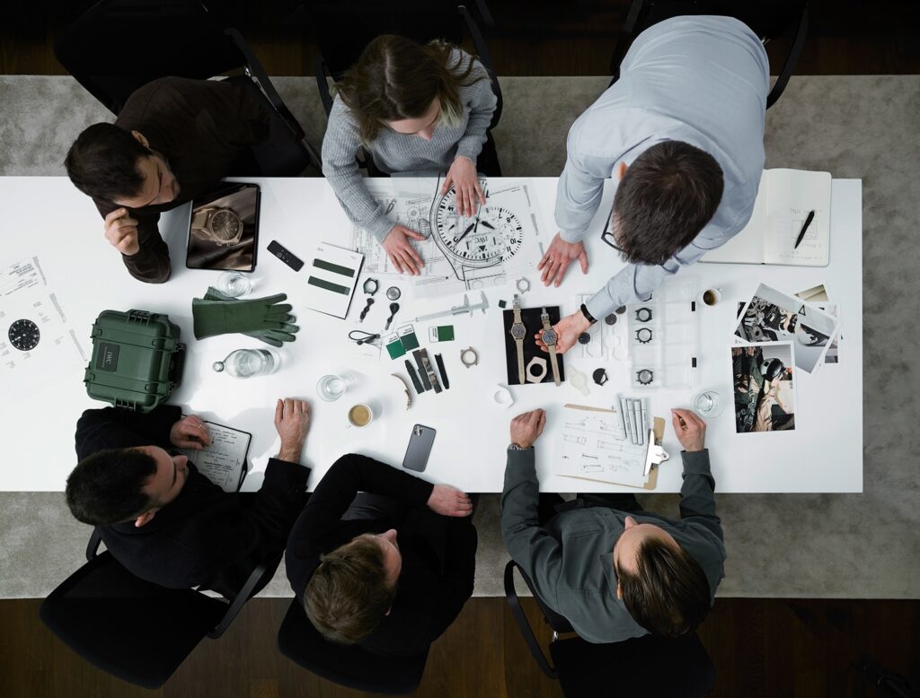 IWC employees working on a design